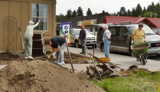 Chiloquin garden club working on the library garden