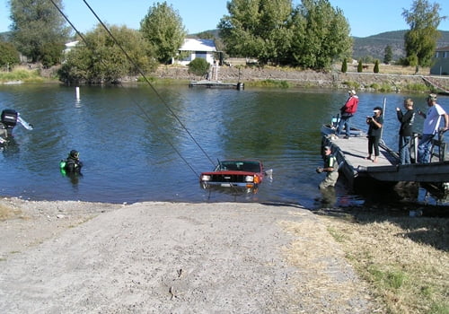 Chiloquin Towing: Totally submerged in the river, complete with trailer